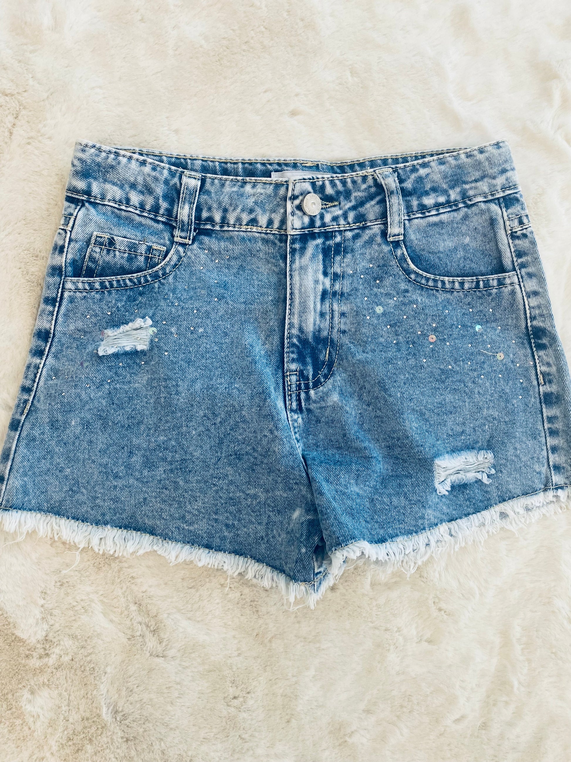 Pantaloncino jeans bambina con strass, strappi e orlo a taglio vivo